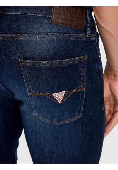 Jeans uomo Guess Chris blu scuro Super Skinny Fit in cotone riciclato 